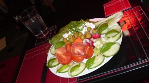 Salad with cottage cheese and a glass of water